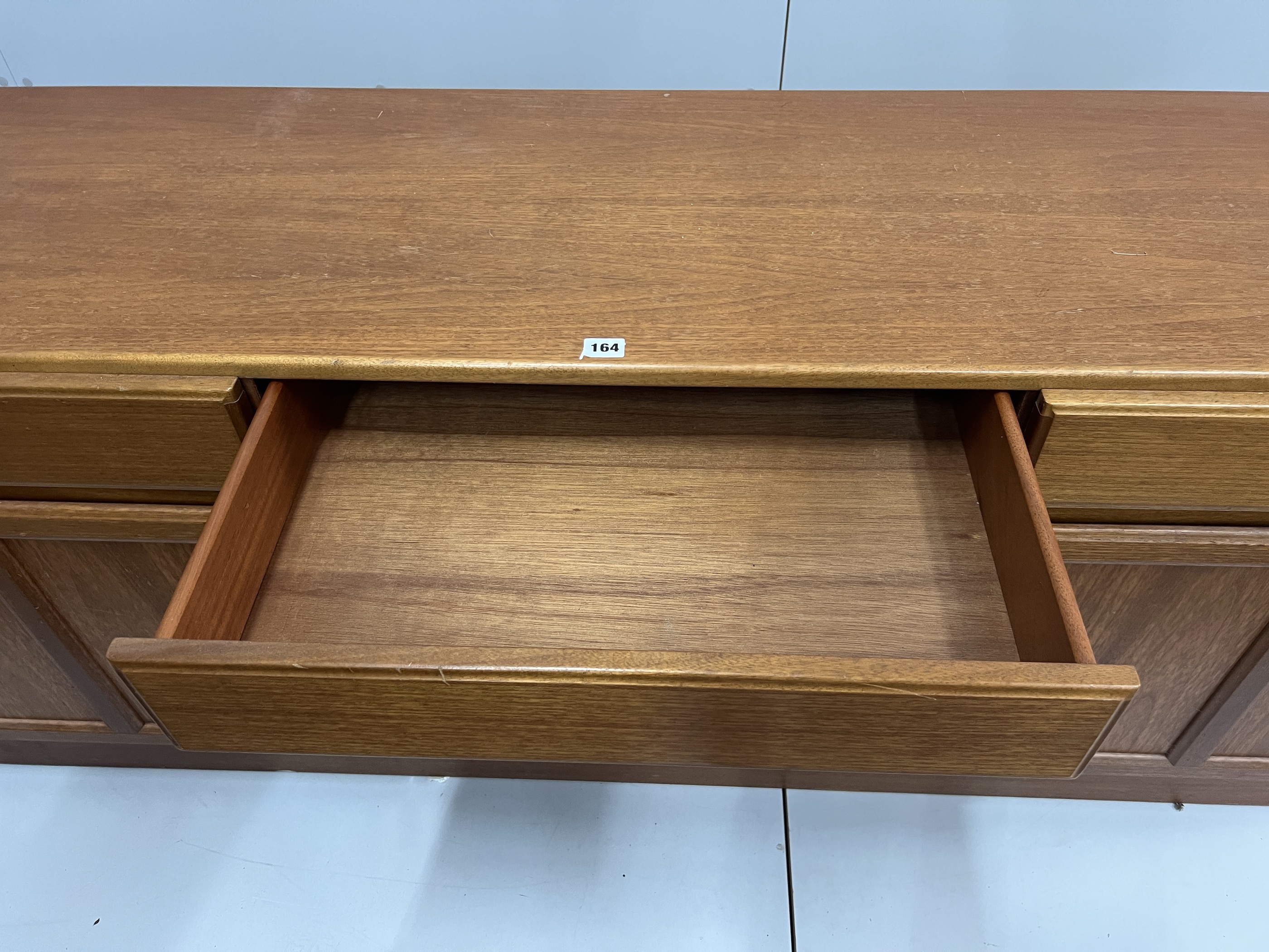 A McIntosh mid century teak sideboard width 181cm, depth 47cm, height 69cm.
